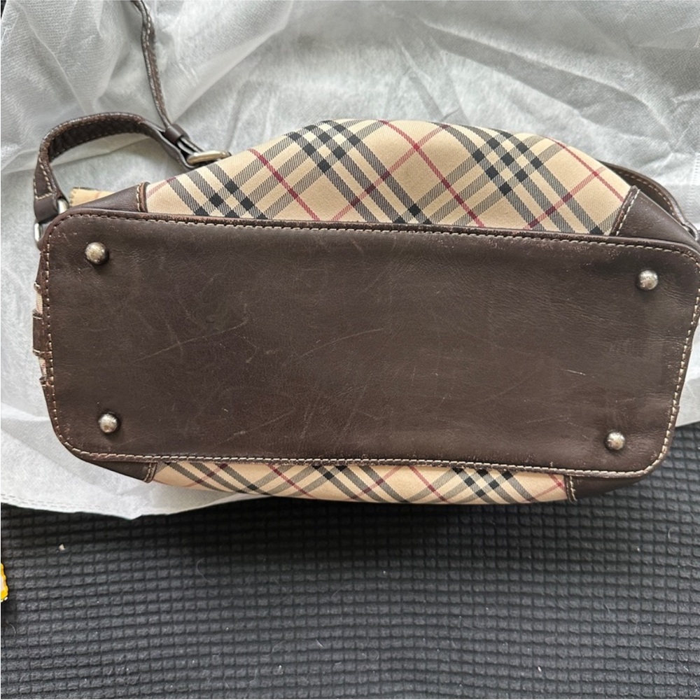 Authentic Burberry Shoulder Bag
Classic Nova check beautiful but has Flaws! - Picture 4 of 8
